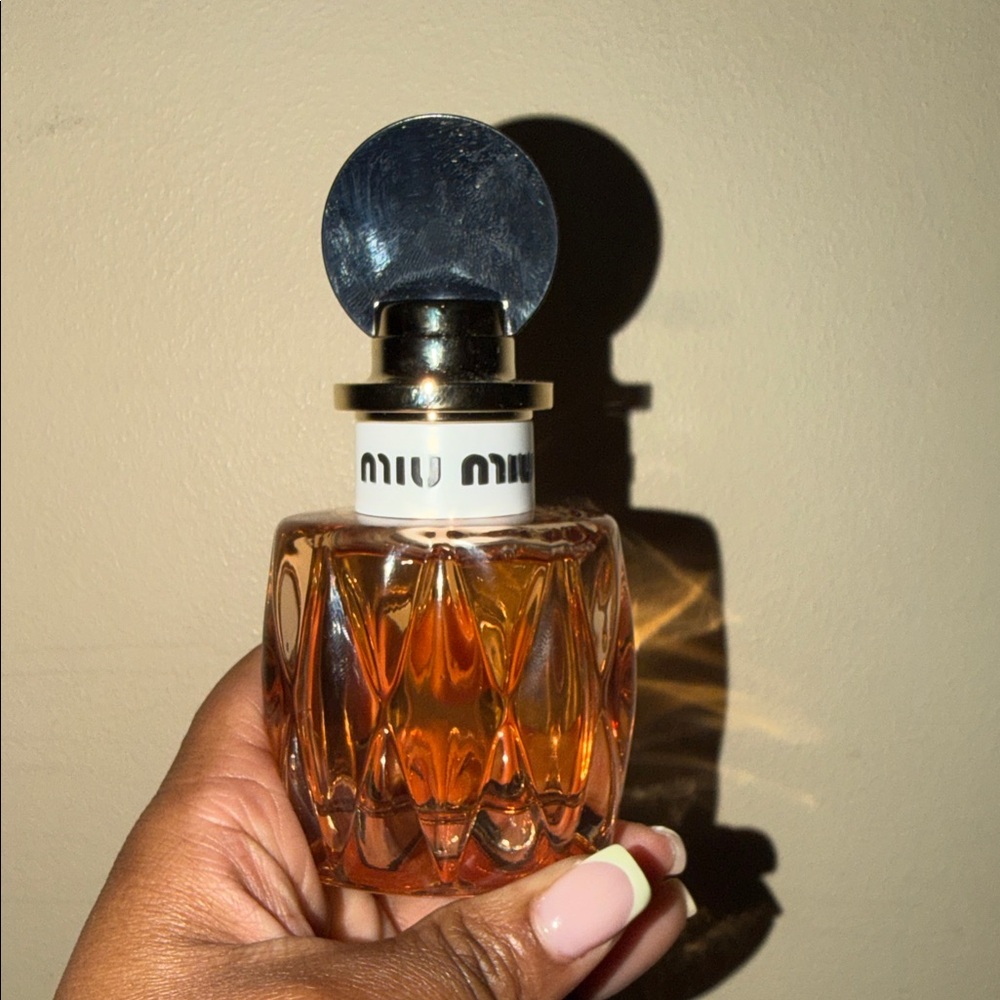 Miu Miu Amber Glass Bottle with Silver Top